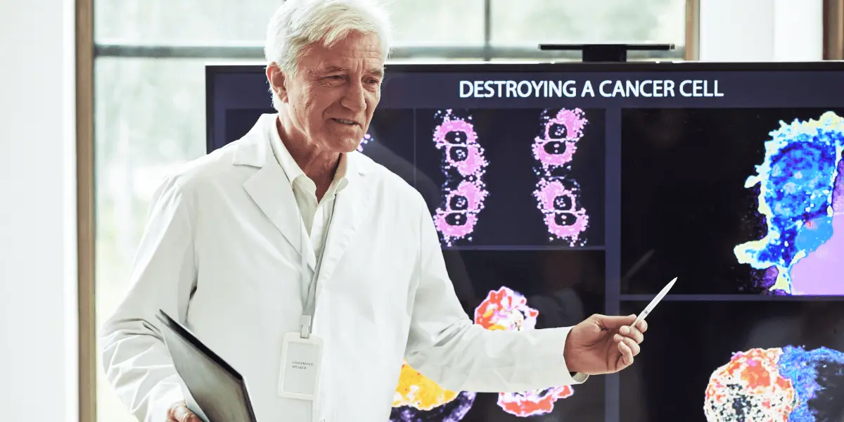 male lab researcher directs a presentation