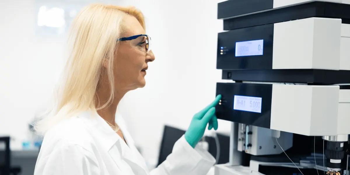woman operates equipment in a lab