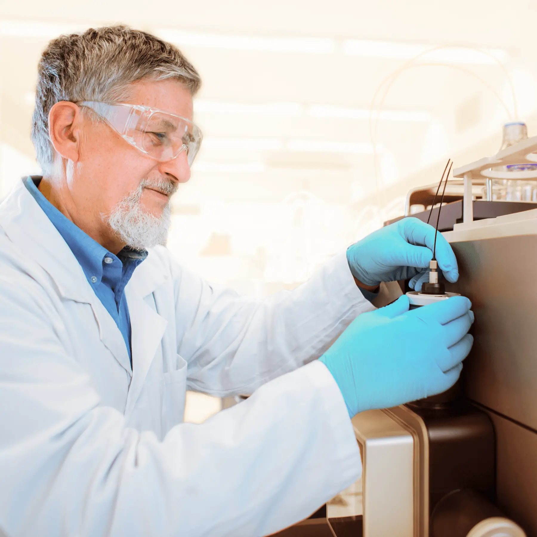 male scientist works at a mass spectrometer