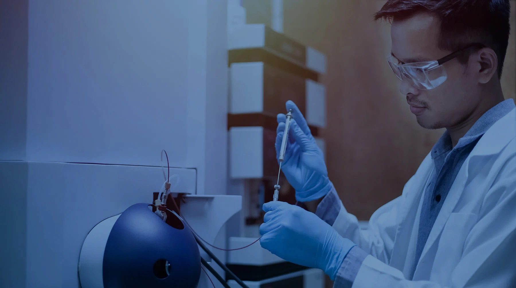 Scientist works with a mass spectrometer