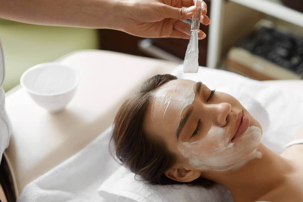 woman receiving facial treatment